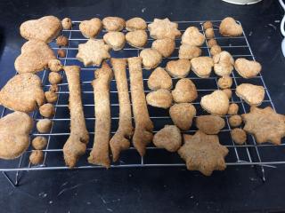 Cooked dog biscuits on cooling rack