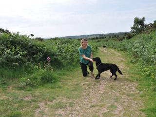 Julie and her dog Maisie on the Pebblebed Heaths